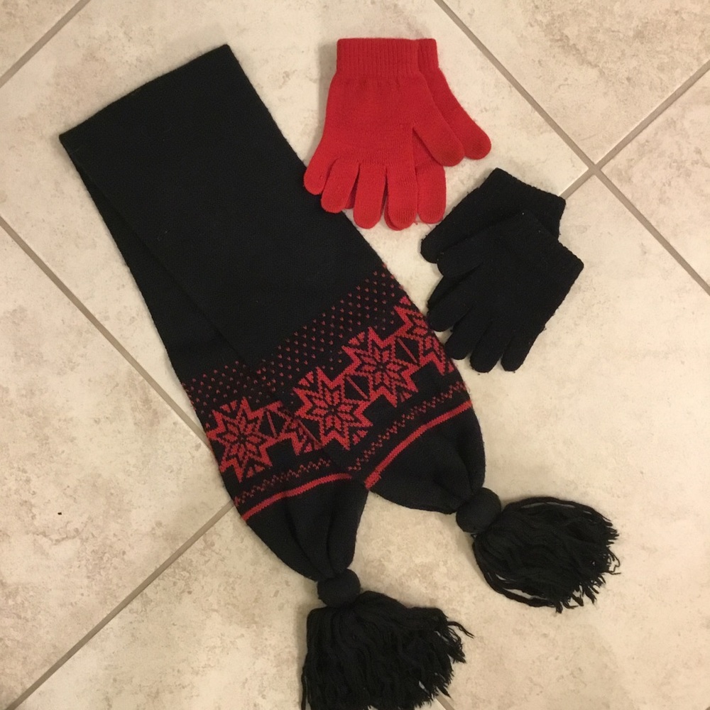 Black and red knit scarf and two sets of knit gloves.